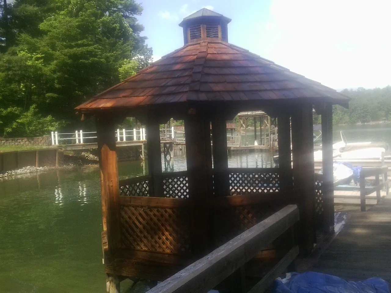 Cedar shake gazebo roof rebuilt on a lake dock in Clifton